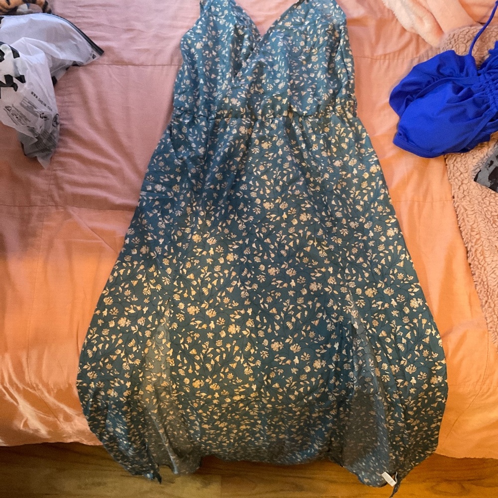 A green dress with flowers on it